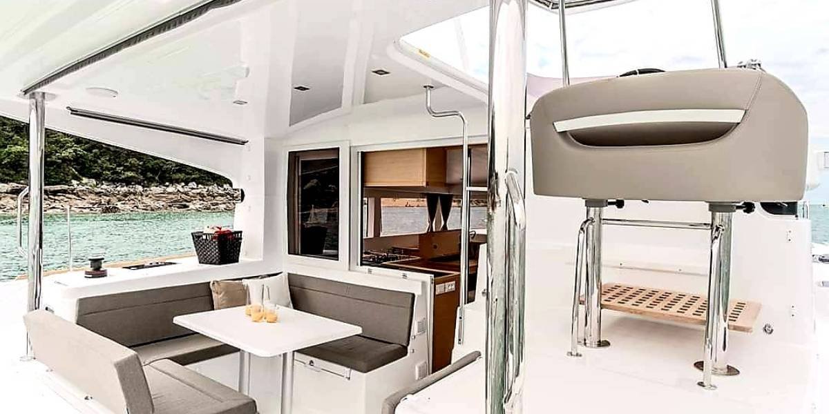 Catamaran anchored in a sheltered cove on the French Riviera